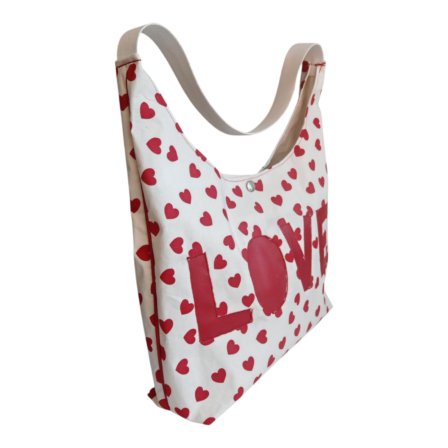 Sac hobo Les RoQuettes.
Modèle love pour un style résolument pin-up, glamour et féminin.
Sac hobo porté épaule motif petits cœurs rouge et insert LOVE en simili cuir rouge.
Se ferme avec une pression argent, anse en sangle de couleur noire.
Petite poche intérieure pour y glisser ses clés.
Dimensions: largeur 40 cm, hauteur de la base 28 cm, hauteur totale à partir du milieu de la anse 62 cm.
Matière: coton et simili cuir/ doublure: coton
Fabrication: Modélisé et fabriqué par Pris