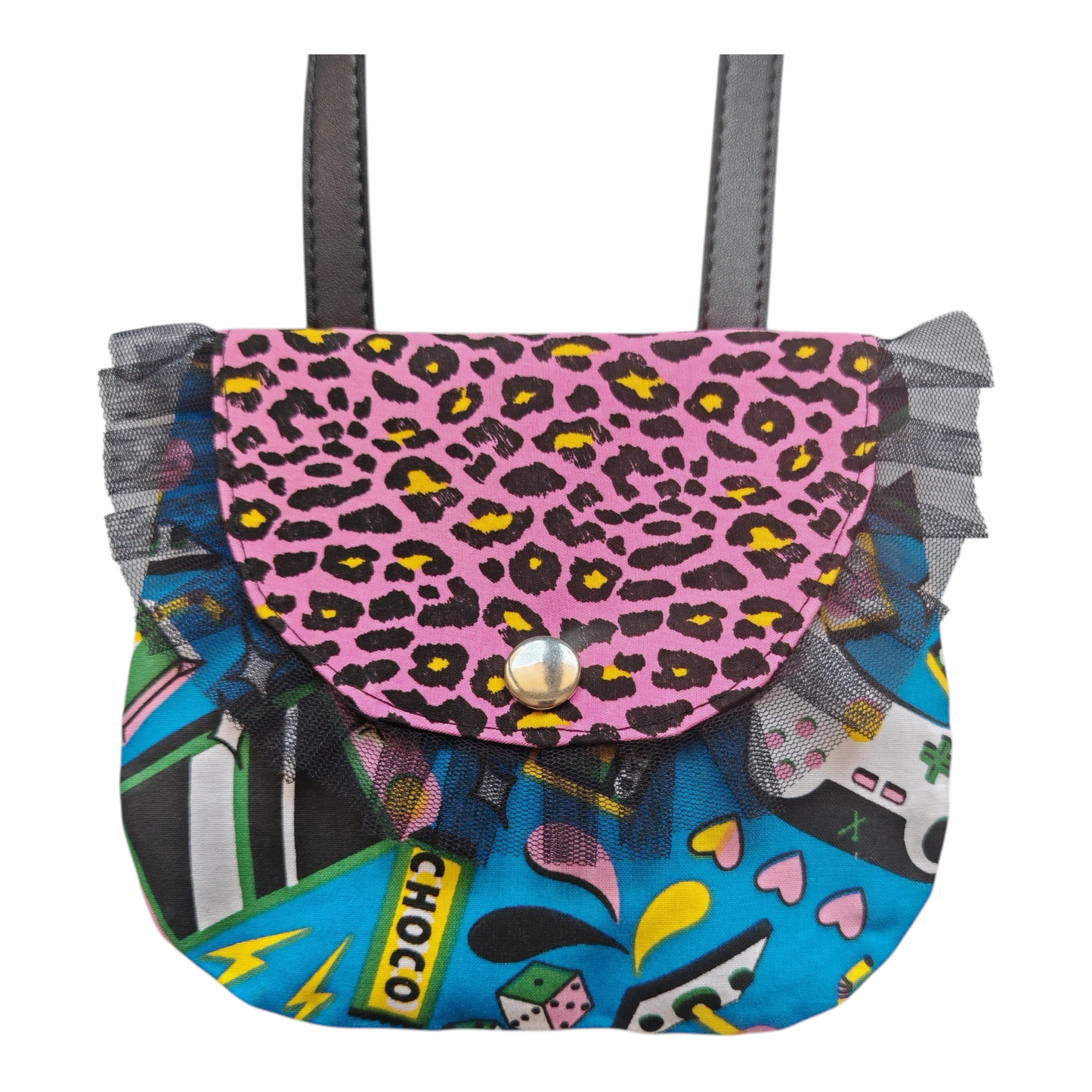 Sac bandoulière enfant motif pop art avec imprimés manettes de jeux vidéo, léopard rose et volant en tulle noir.