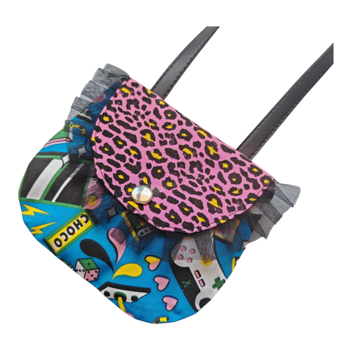 Sac bandoulière enfant motif pop art avec imprimés manettes de jeux vidéo, léopard rose et volant en tulle noir.