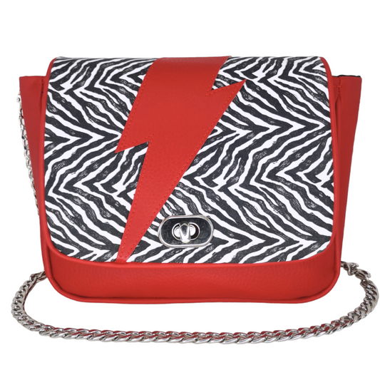 Sac à main bandoulière rock Les RoQuettes, modèle Bowie zébré noir et blanc avec éclair rouge et chaîne argentée.